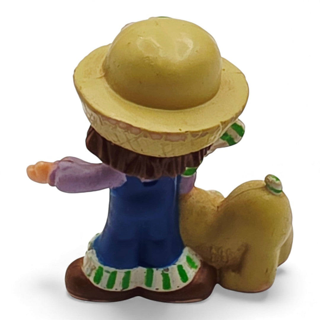 Vintage 1980s mini pvc figure. Strawberryland Miniatures. Huckleberry Pie. With Pupcake 2". Back view.