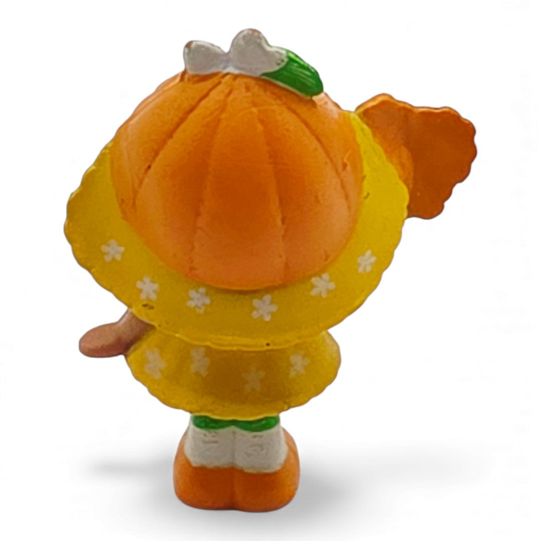 Vintage 1980s mini pvc figure. Strawberryland Miniatures. Orange Blossom. With Butterfly 2". Back view.