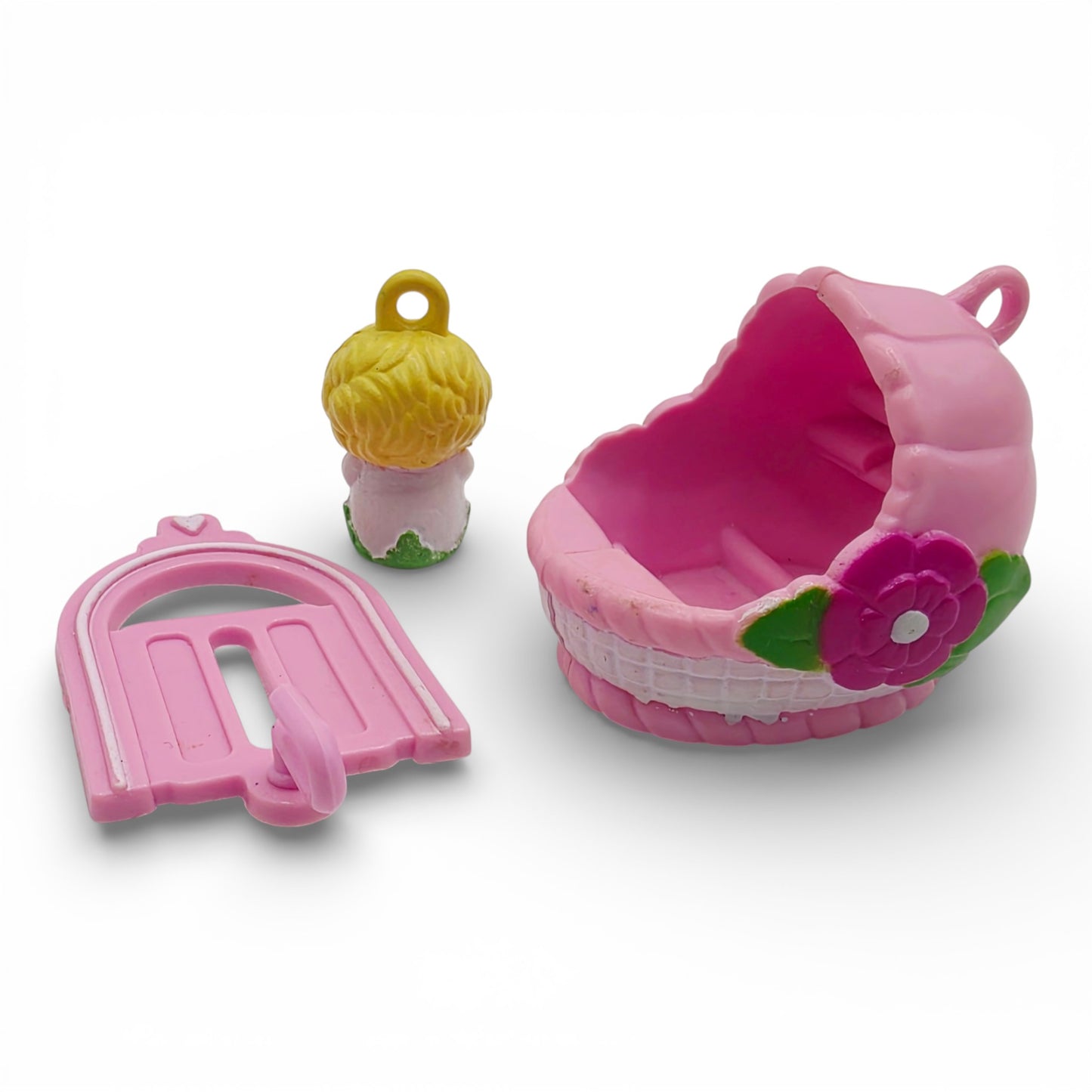 Vintage 1980s small toy. Second Release. Baby Sunshine. Complete with Original Bassinette & Pocket Clip. Right view.