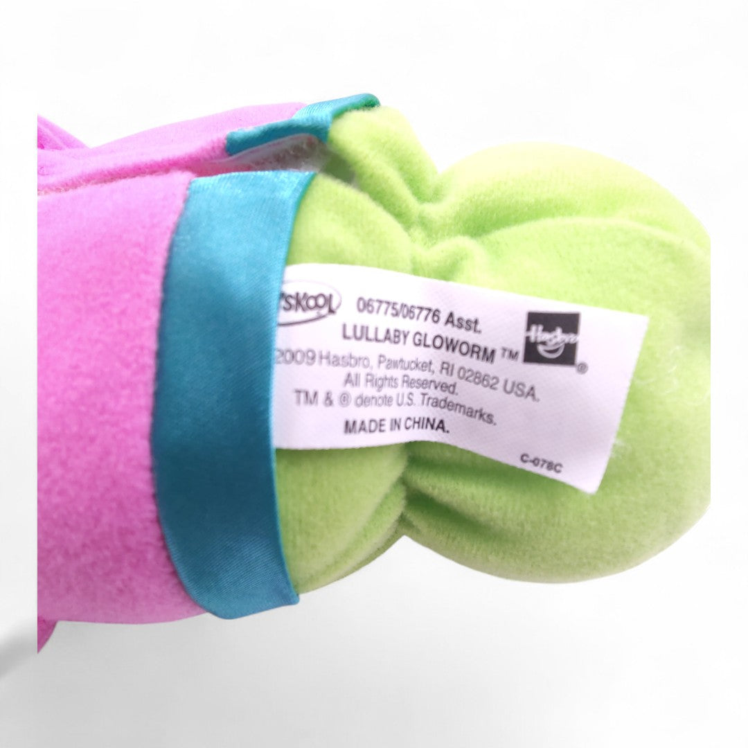 Vintage 2000s plush. Lullaby Gloworm (Pink). Music Box & Glowing Face 9". Close up 1 view.