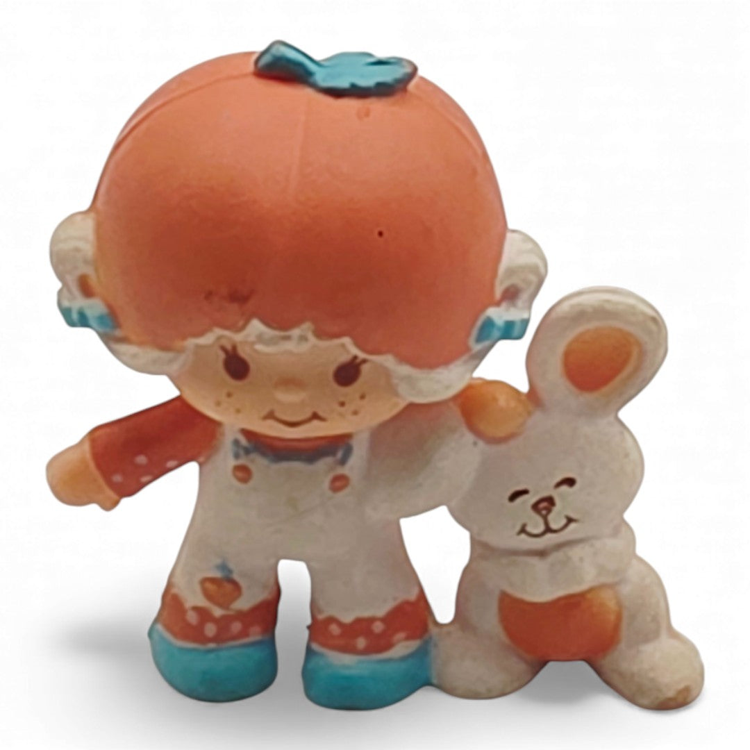 Vintage 1980s mini pvc figure. Strawberryland Miniatures. Apricot. With Hopsalot 2". Front view.