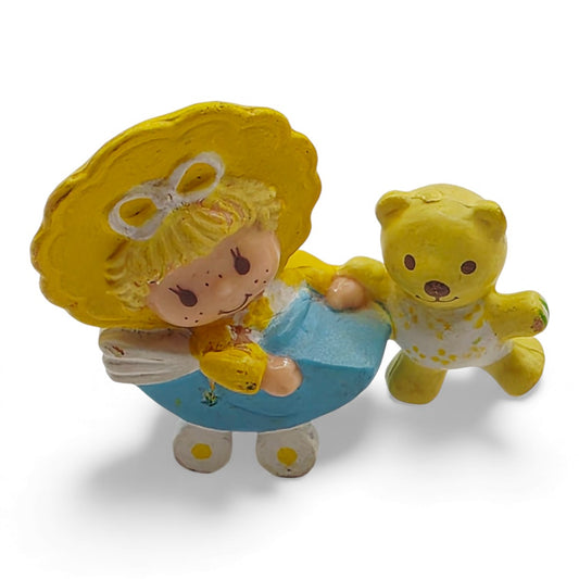 Vintage 1980s mini pvc figure. Strawberryland Miniatures. Butter Cookie. Jelly Bear in Stroller 2". Front view.