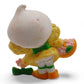 Vintage 1980s mini pvc figure. Strawberryland Miniatures. Lemon Meringue. Picking Flowers 2". Back view.