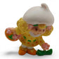 Vintage 1980s mini pvc figure. Strawberryland Miniatures. Lemon Meringue. Picking Flowers 2". Front view.
