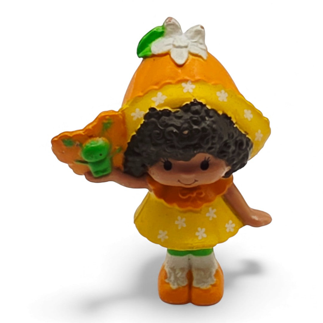 Vintage 1980s mini pvc figure. Strawberryland Miniatures. Orange Blossom. With Butterfly 2". Front view.