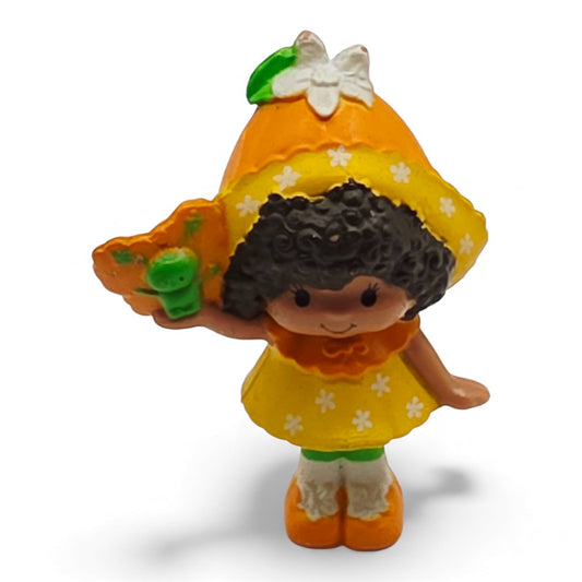 Vintage 1980s mini pvc figure. Strawberryland Miniatures. Orange Blossom. With Butterfly 2". Front view.