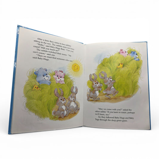 Vintage 1980s story book. Baby Hugs & Baby Tugs Counting Book. Hardcover Storybook. Close up 1 view.
