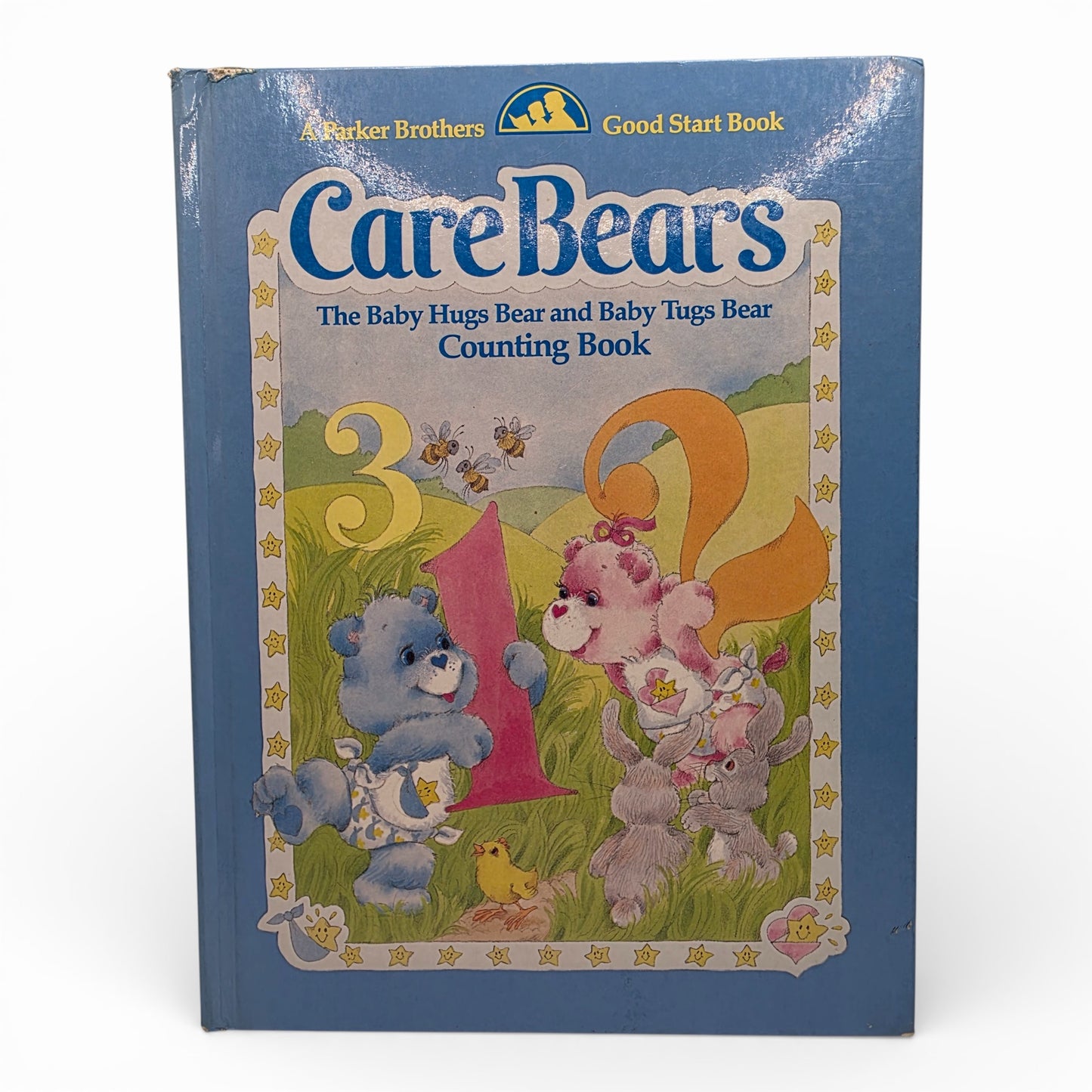 Vintage 1980s story book. Baby Hugs & Baby Tugs Counting Book. Hardcover Storybook. Front view.