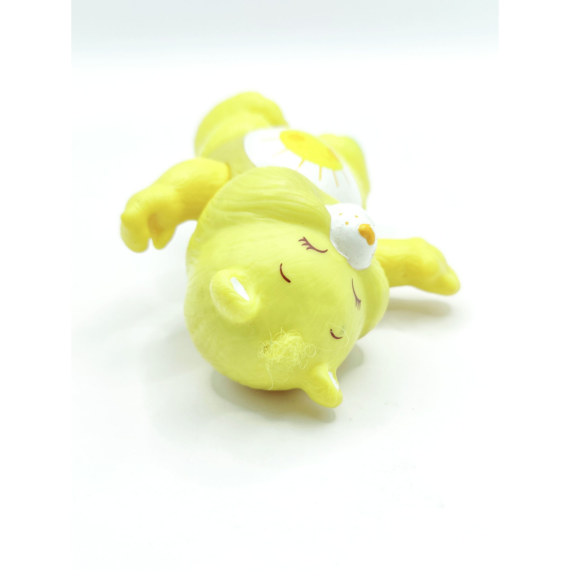 Vintage 1980s mini pvc figure. Poseable PVC Figure. Funshine. 3.5". Top view.