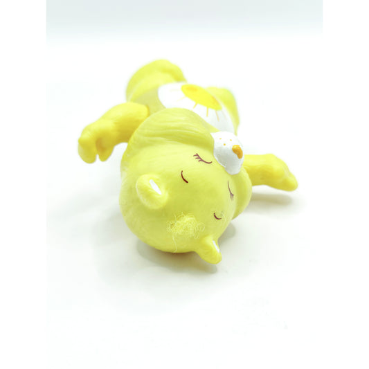 Vintage 1980s mini pvc figure. Poseable PVC Figure. Funshine. 3.5". Top view.