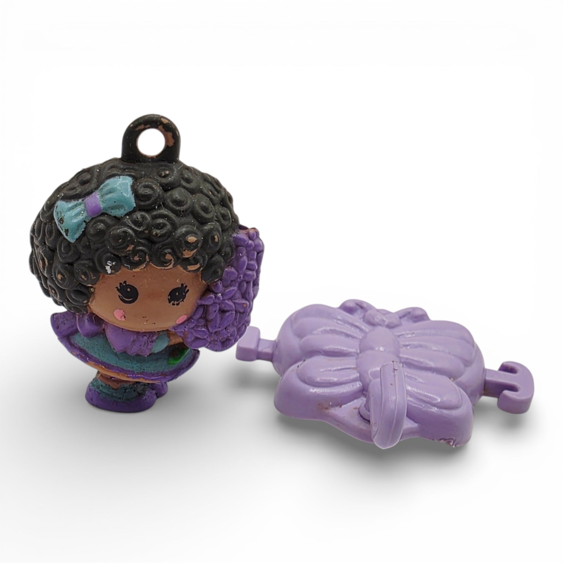 Vintage 1980s small toy. First Release. Hyacinthia. With Original Butterfly Hair Clip & Rare. Close up 1 view.