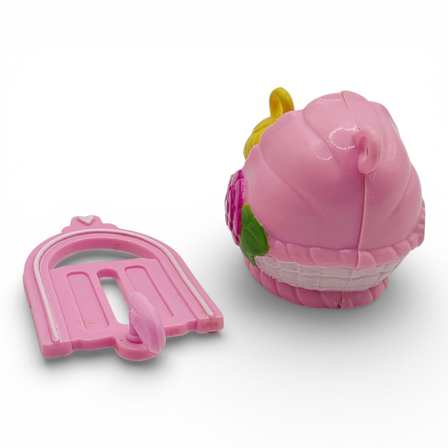 Vintage 1980s small toy. Second Release. Baby Sunshine. Complete with Original Bassinette & Pocket Clip. Back view.