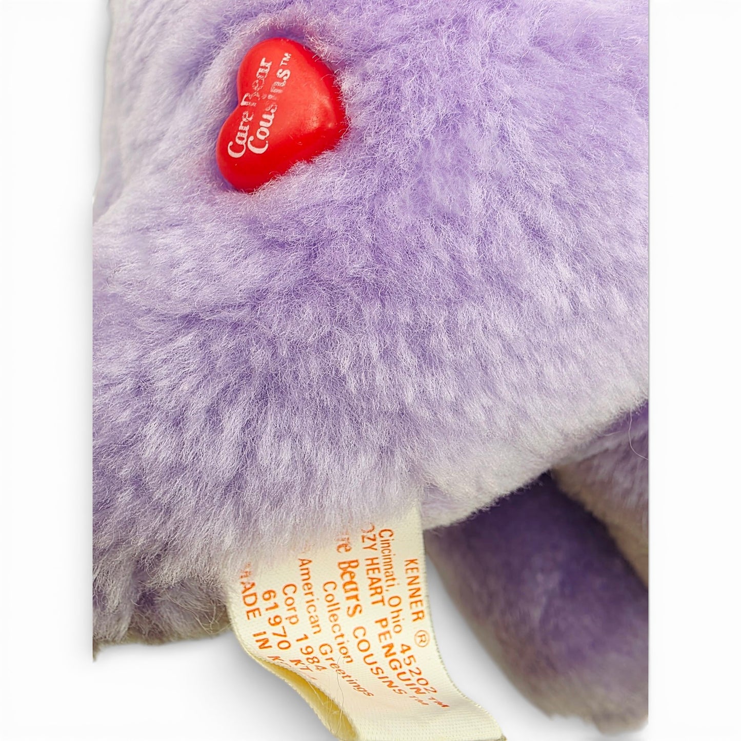 Vintage 1980s plush. Cozy Heart Penguin. 36cm Plush. Close up 2 view.