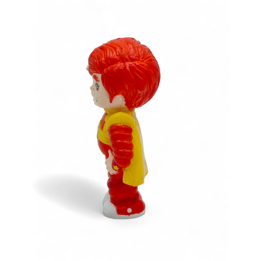 Vintage 1980s mini pvc figure. Mini PVC Figure. Red Butler. 6cm. Left view.