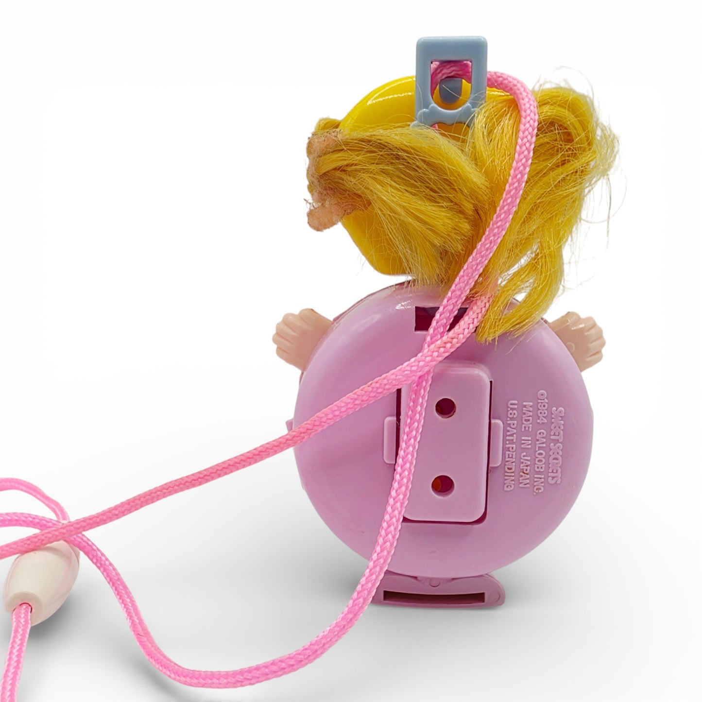 Vintage 1980s small toy. Series 1. Shinie. Comes with Necklace Clip!. Back view.