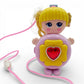Vintage 1980s small toy. Series 1. Shinie. Comes with Necklace Clip!. Front view.