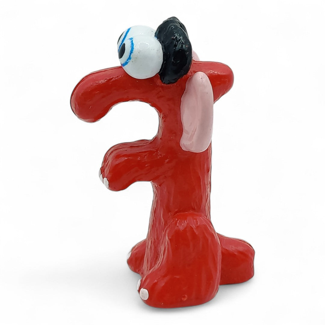 Vintage 1980s mini pvc figure. Fuzzle. 2" Mini Figure. Left view.