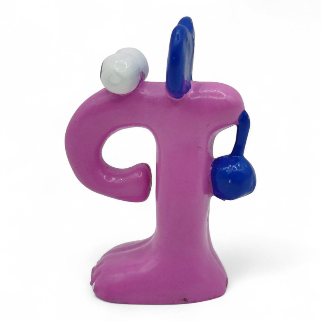 Vintage 1980s mini pvc figure. Puphin. 2" Mini Figure. Left view.