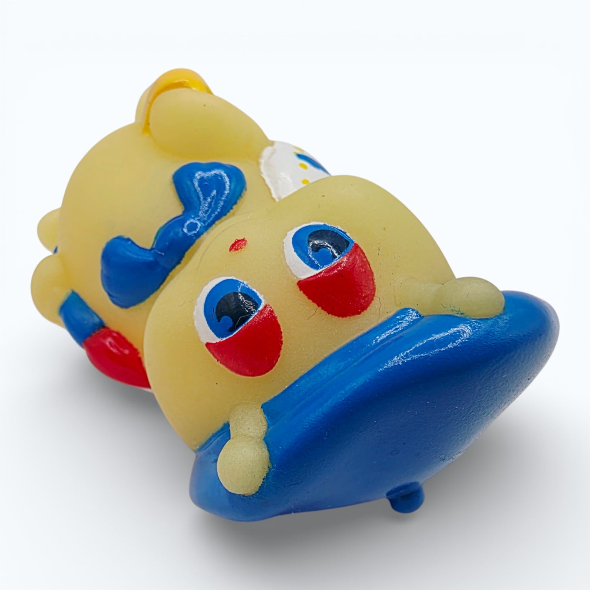 Vintage 1980s mini pvc figure. Glo Doodlebug. 3". Top view.