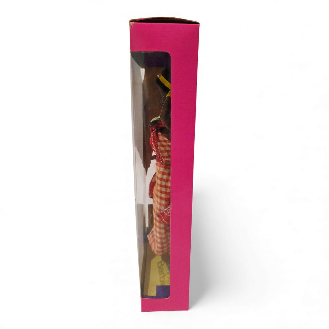 Vintage 1990s doll. Dolls of the World. Kenyan Barbie. Left view.