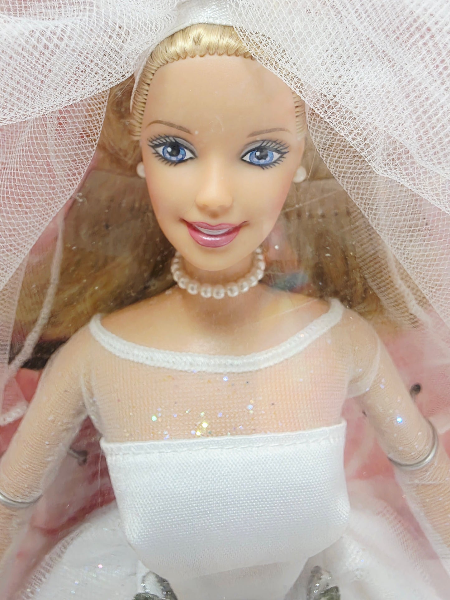 Vintage 1990s doll. Blushing Bride Barbie. Face view.