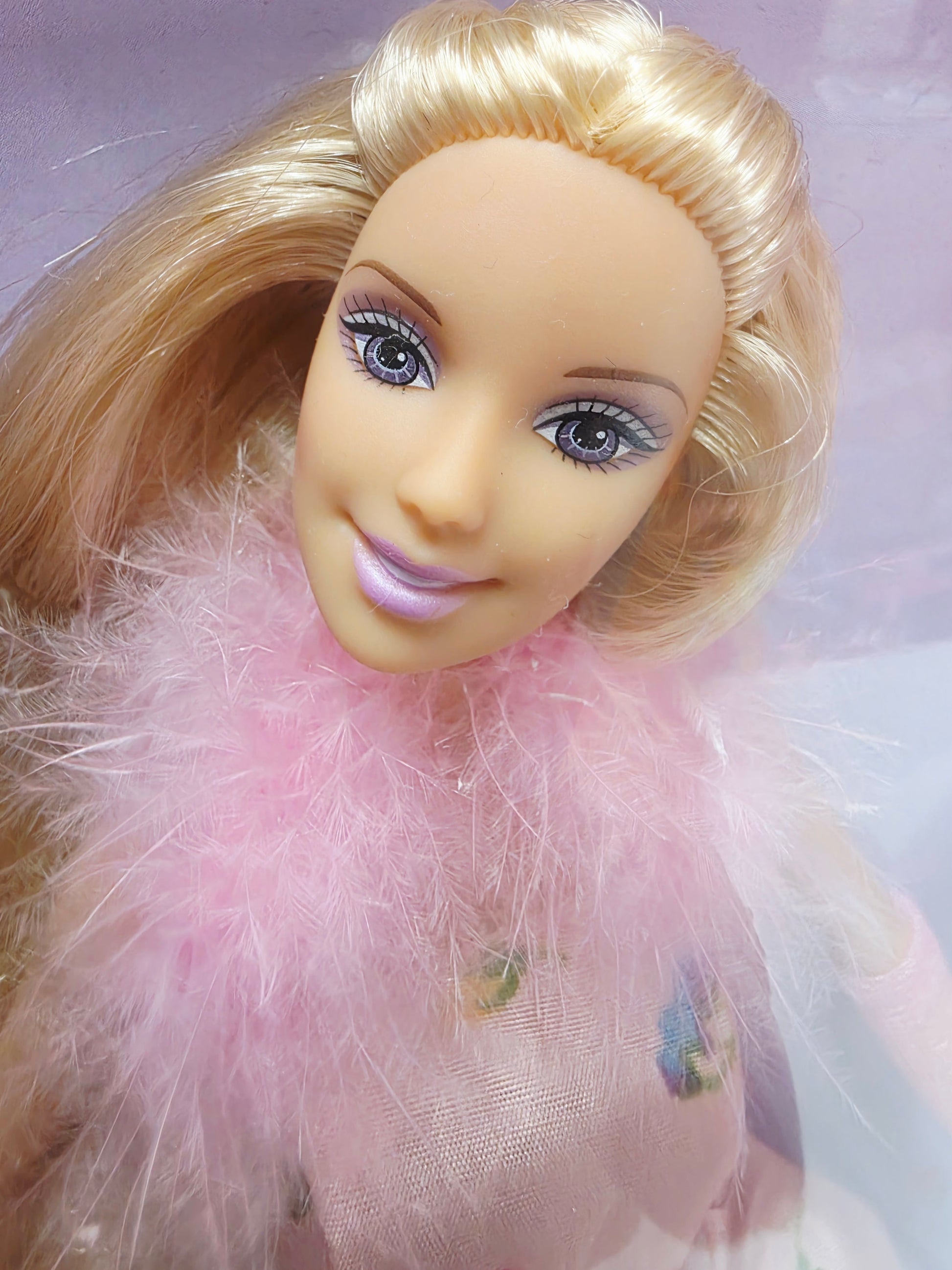 Vintage 2000s doll. Flower Surprise Barbie. Face view.