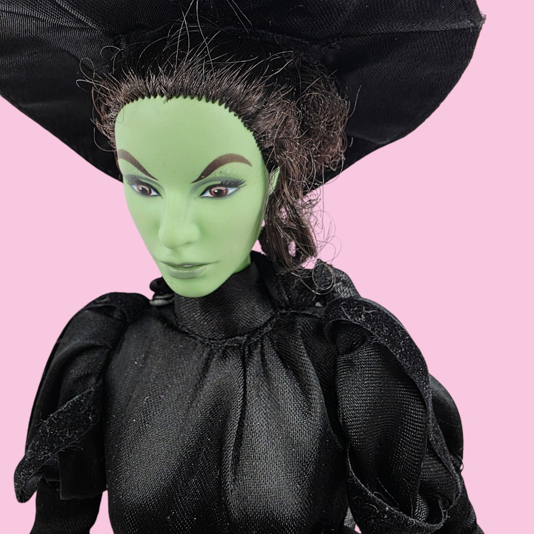 Vintage 2000s doll. Wizard of Oz. Wicked Witch. Pink Label Barbie. Face view.